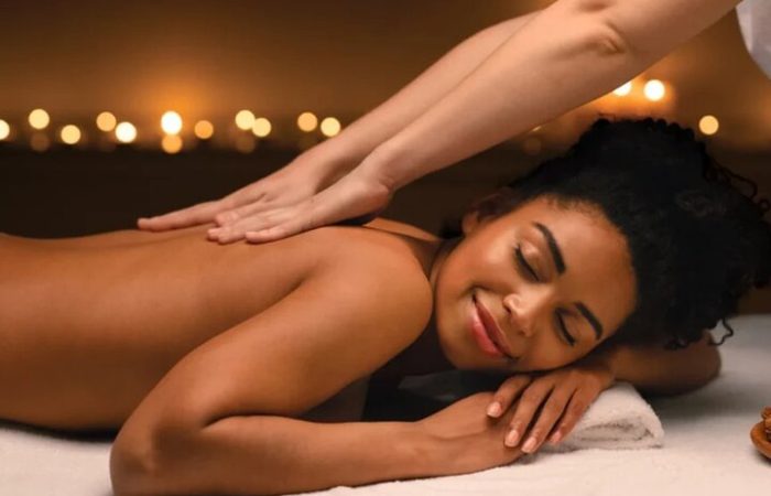 Therapist giving a full-body massage for relaxation